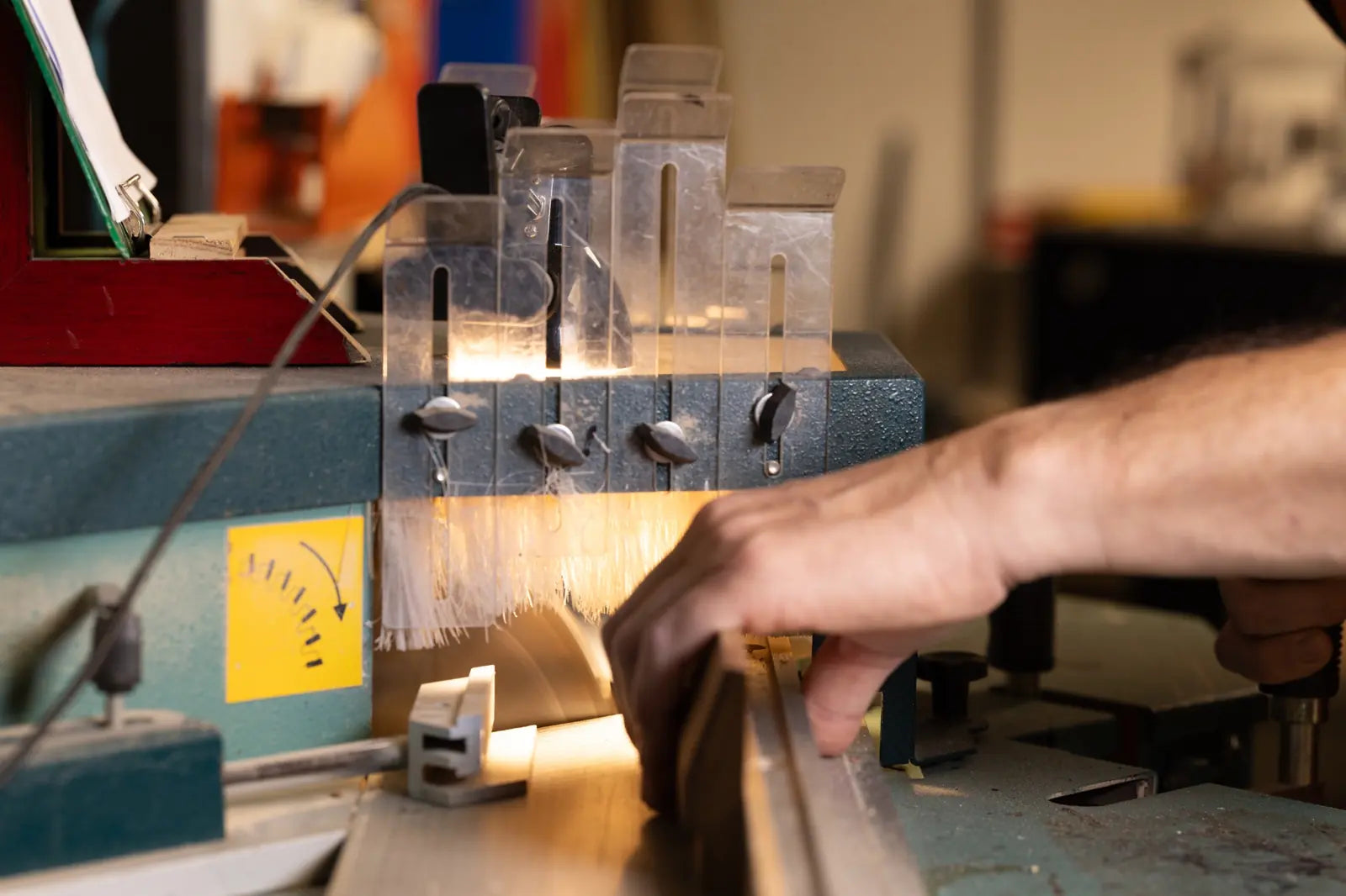 Framer operating a saw, cutting an ACME Wedge moulding.