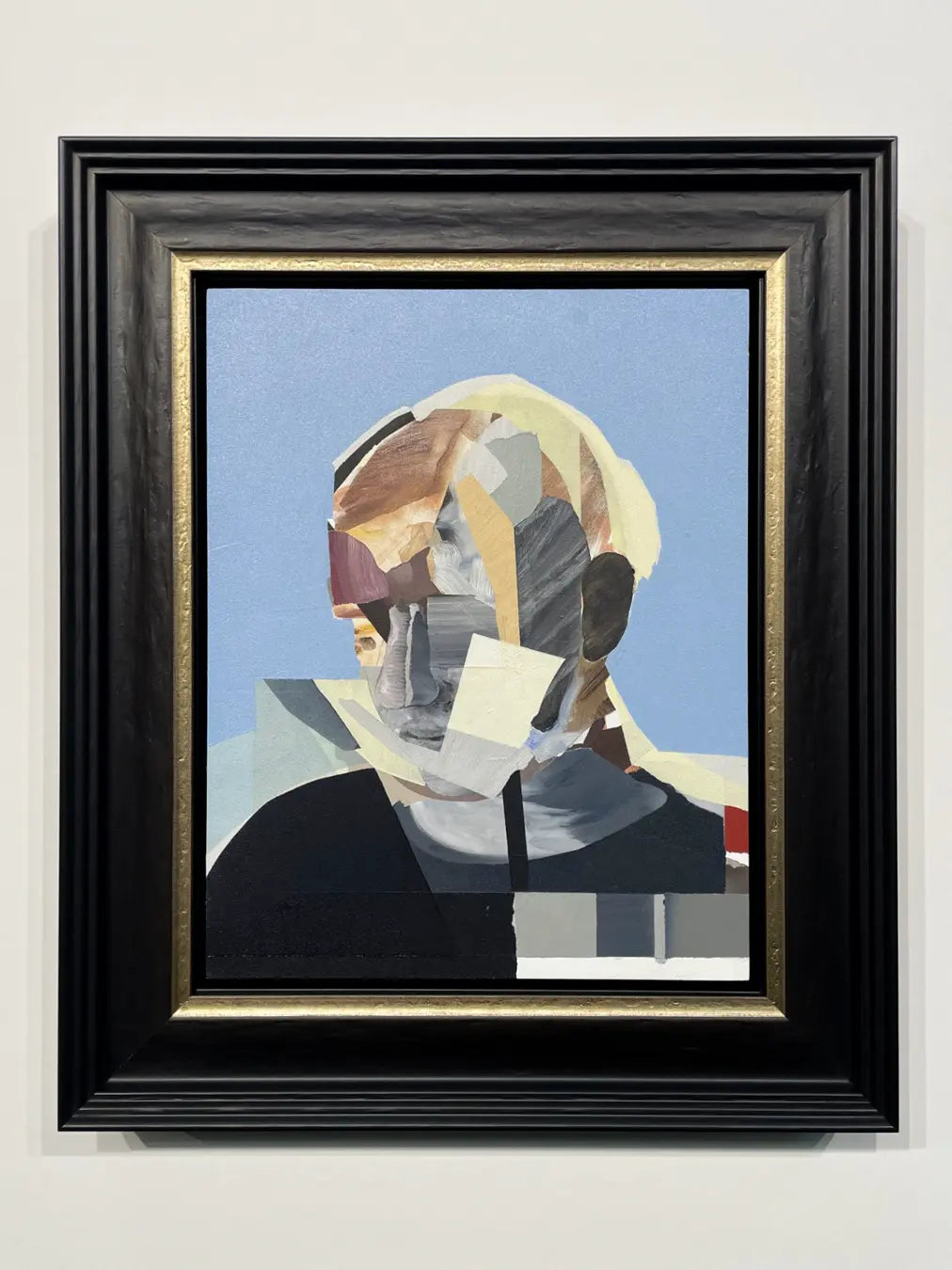 Contemporary portrait artwork custom framed in a handcrafted black timber picture frame with a gold slip, demonstrating bespoke picture framing by ACME Framing.