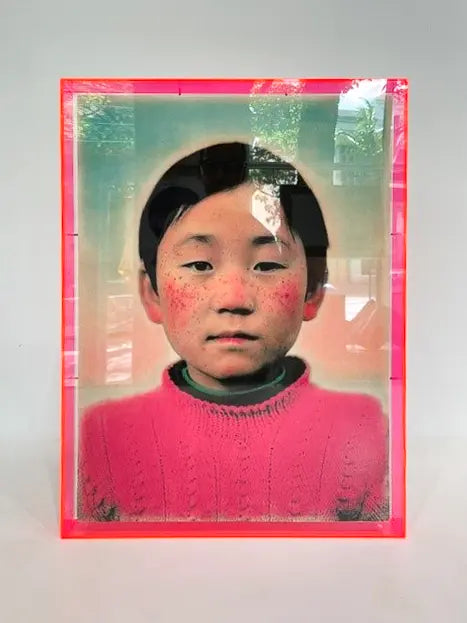 Contemporary portrait artwork custom framed in a bespoke neon pink acrylic box frame, handcrafted by ACME Framing.