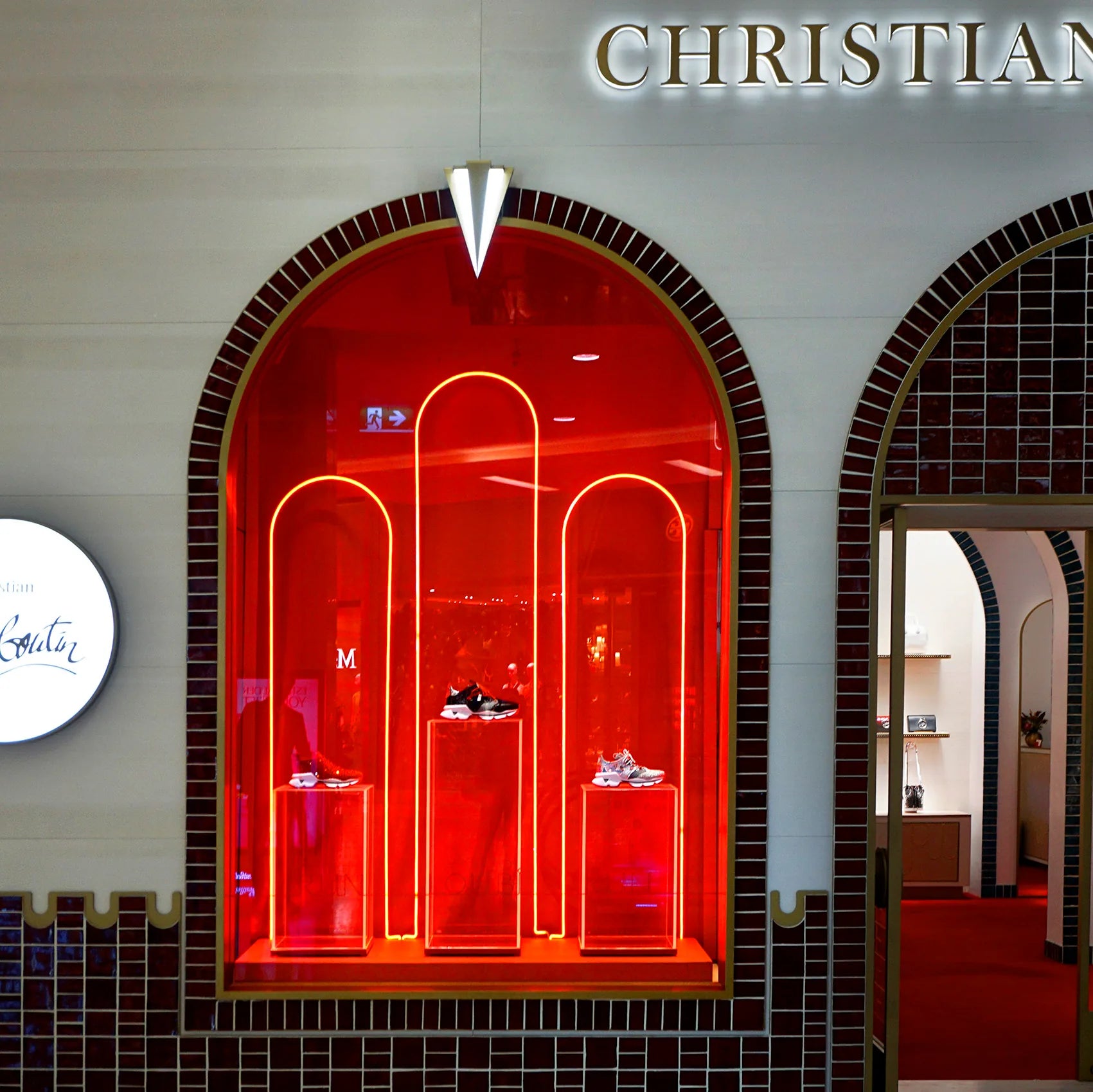 Custom finished luxury retail display for Christian Louboutin featuring bespoke fabrication, premium finishes and illuminated presentation.