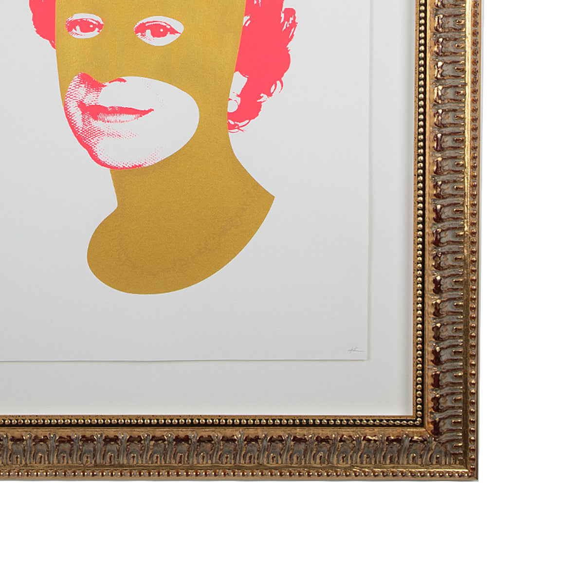 Detail of contemporary Queen portrait artwork in an ornate gold frame with white mat.