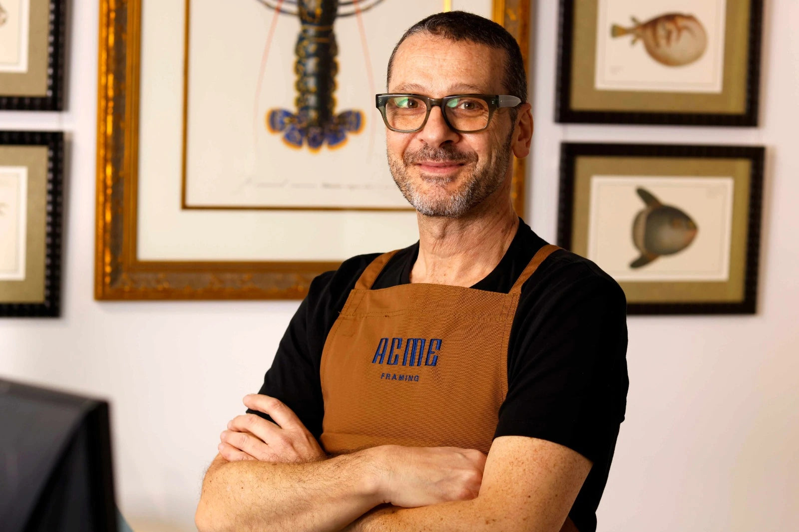ACME Framing expert providing collection, artwork care and picture framing advice in the Sydney studio to help preserve and protect framed artworks.